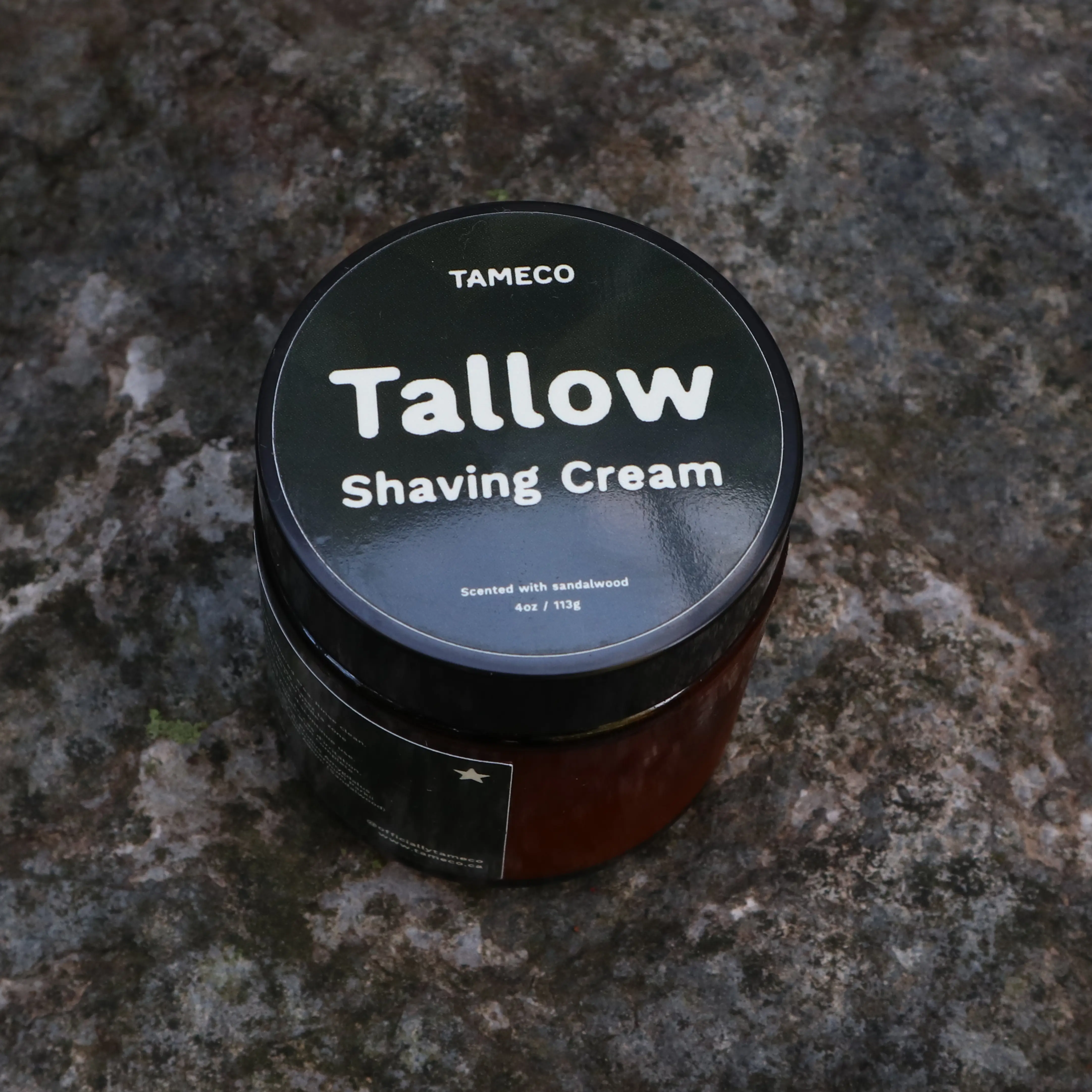 Tameco tallow shaving cream jar resting on stone